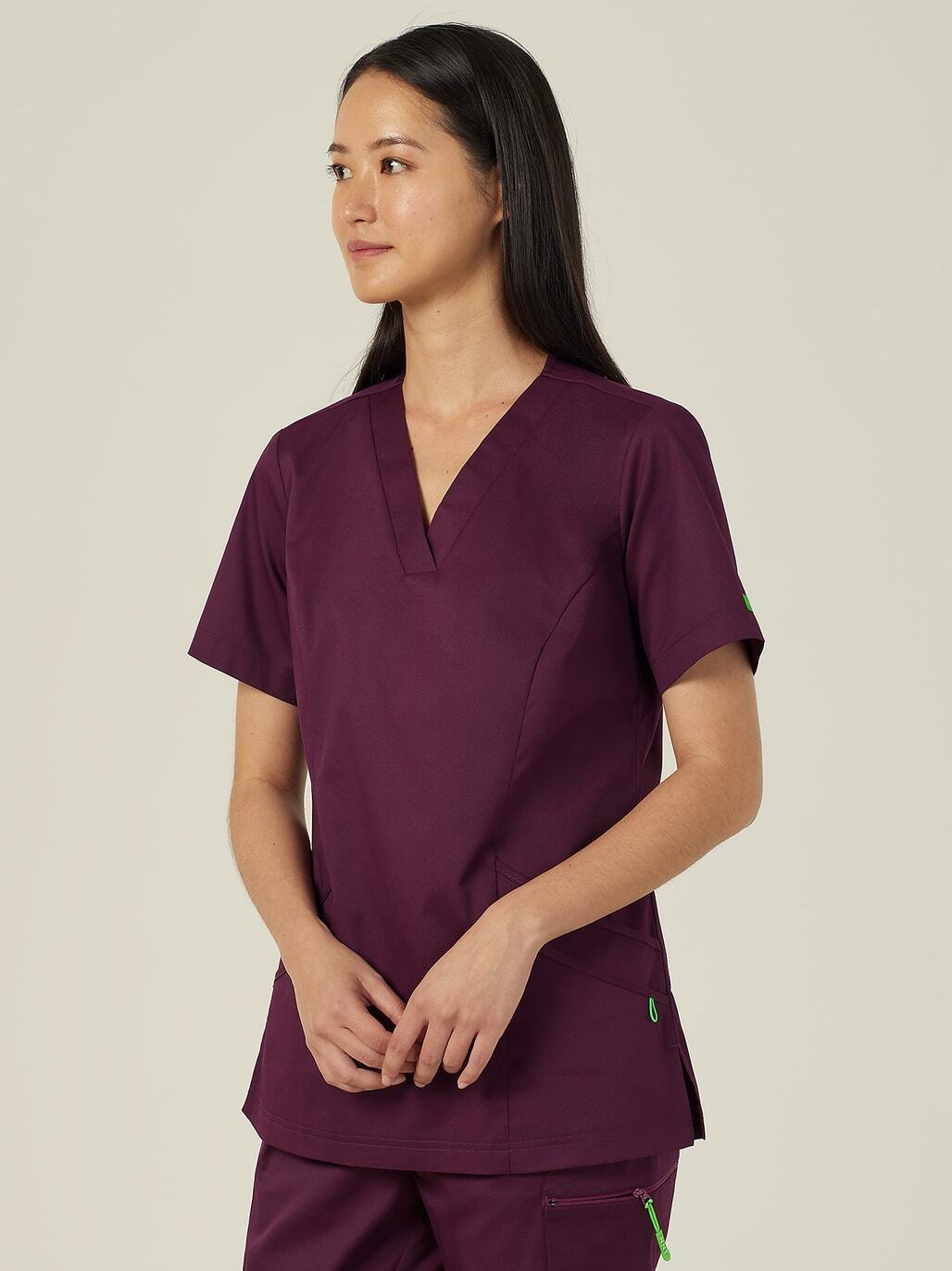 A woman in purple scrubs.
