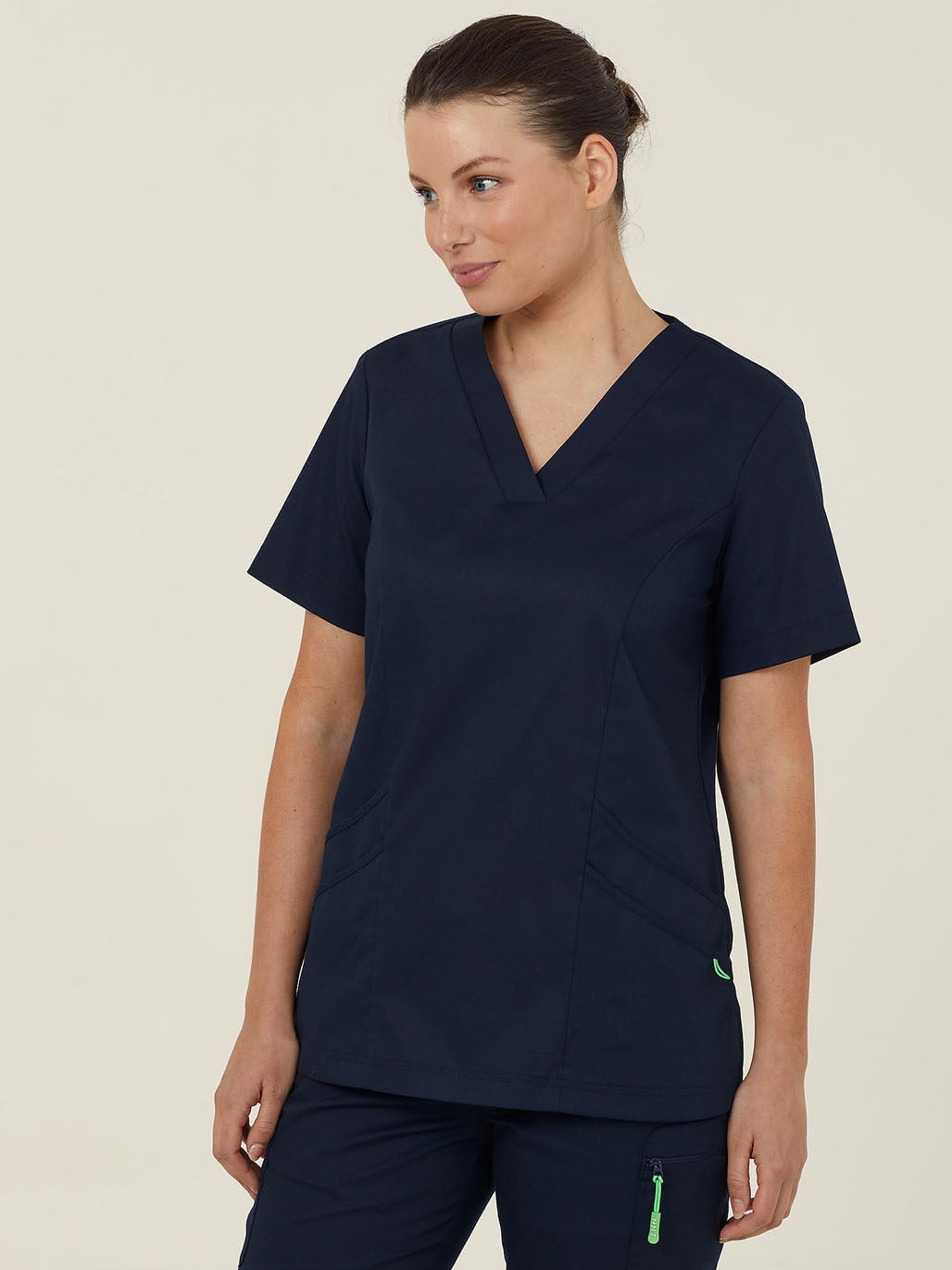 Woman in navy blue scrubs.