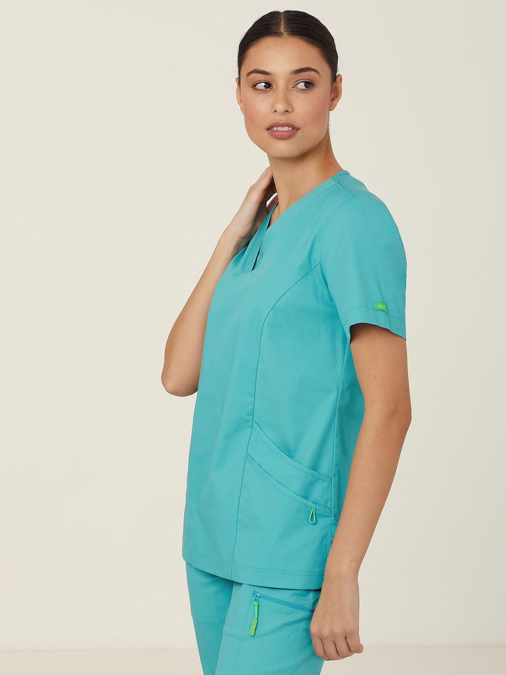 A woman in teal scrubs.